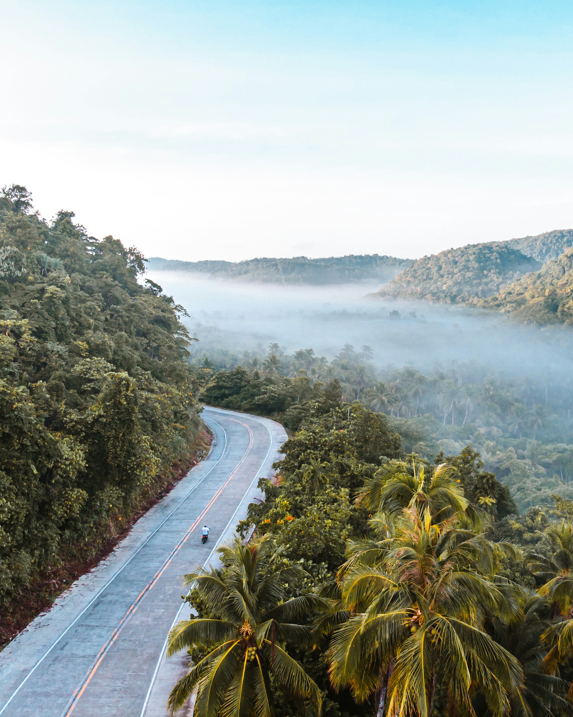 image of a motorcyclist on an open road